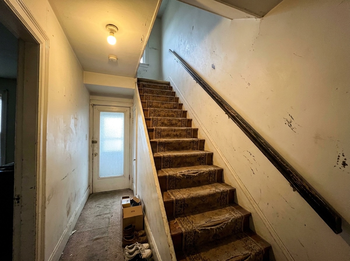 Worn carpeted staircase before refresh